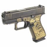 43X Compensated, Laser Engraved Dragon, Striker Fired, Semi-automatic, Polymer Frame Pistol, Sub-Compact, 9MM, 3.41" Barrel, Distressed Black and Gold Cerakote, Fixed Sights, 2 Magazines, Right Hand, Ported Slide and Barrel, Optic Cut, Static Stippling,